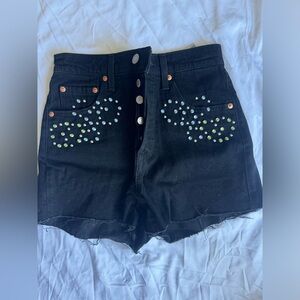 Brand new Levi’s black shorts in size 25 with gems on front.